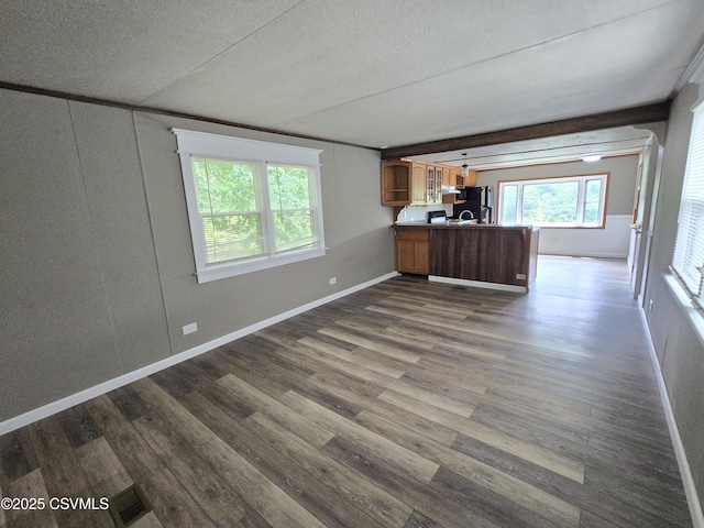 1824 Smalsh Barrick Rd, Middleburg, PA 17842 - unfurnished living room with dark wood-type flooring and a textured ceiling