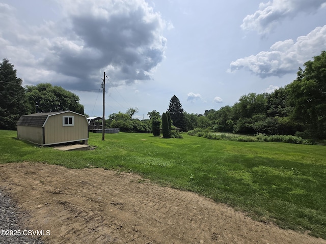 1824 Smalsh Barrick Rd, Middleburg, PA 17842 - view of grassy yard featuring a storage shed