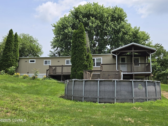 1824 Smalsh Barrick Rd, Middleburg, PA 17842 - rear view of house featuring a yard and a wooden deck