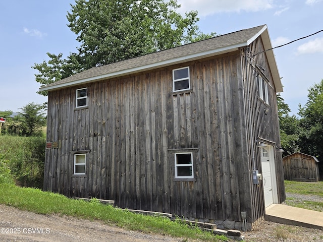 1824 Smalsh Barrick Rd, Middleburg, PA 17842 - view of home's exterior featuring a storage shed and a shingled roof