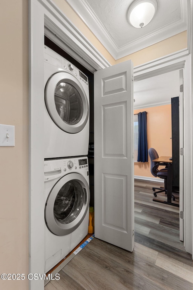 378 Drinker St, Bloomsburg, PA 17815 - laundry room featuring stacked washer / dryer, a desk, crown molding, and wood finished floors