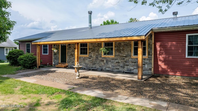 909 Fair St, Nescopeck, PA 18635 - view of front of home featuring a metal roof and stone siding