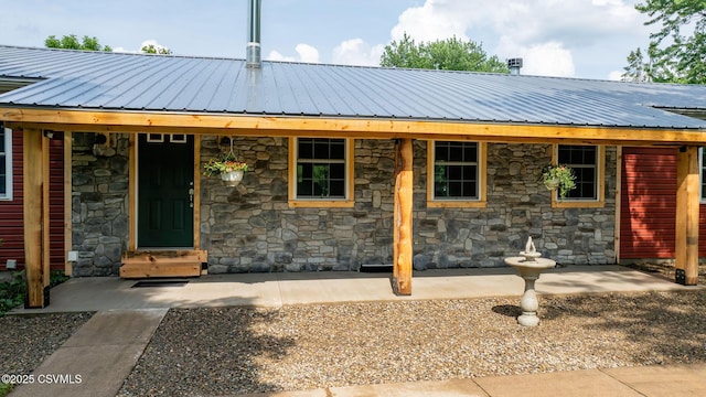 909 Fair St, Nescopeck, PA 18635 - view of front facade with stone siding and a metal roof