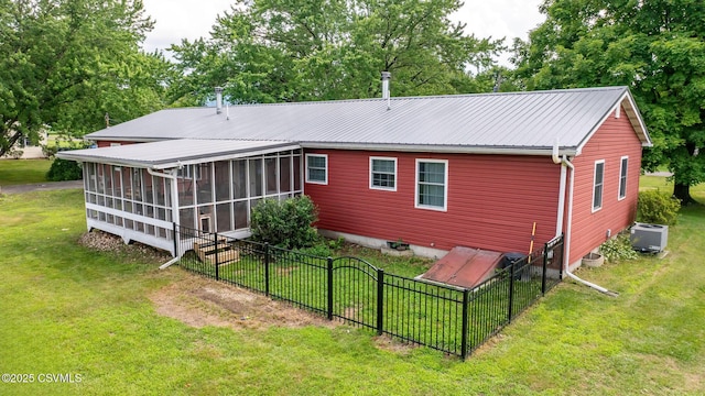 909 Fair St, Nescopeck, PA 18635 - rear view of house featuring a sunroom, a metal roof, crawl space, and view of wooded area