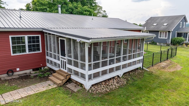 909 Fair St, Nescopeck, PA 18635 - rear view of property featuring a sunroom, a metal roof, and entry steps