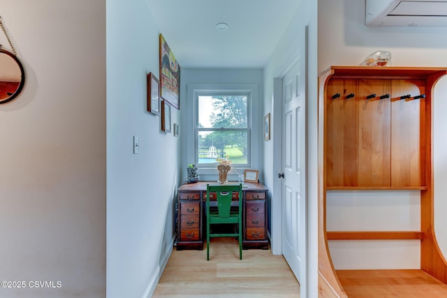 909 Fair St, Nescopeck, PA 18635 - corridor with light wood-style floors and an AC wall unit