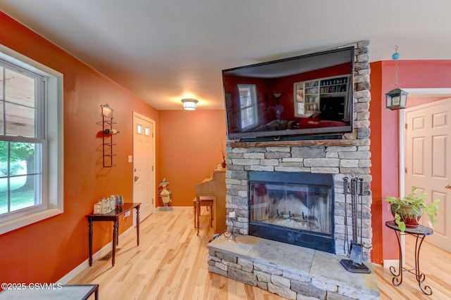 909 Fair St, Nescopeck, PA 18635 - living area featuring wood finished floors and a stone fireplace