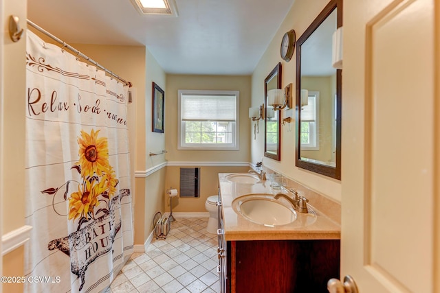 909 Fair St, Nescopeck, PA 18635 - full bath featuring tile patterned flooring, double vanity, and curtained shower
