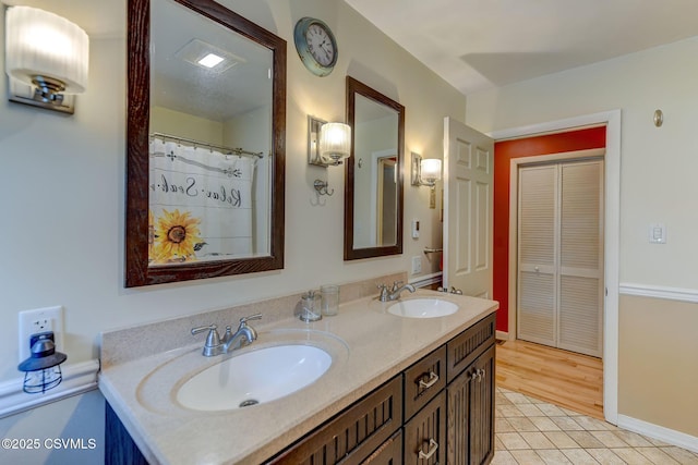 909 Fair St, Nescopeck, PA 18635 - full bath with double vanity and tile patterned floors