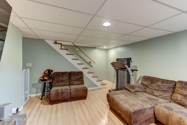 909 Fair St, Nescopeck, PA 18635 - living room featuring wood finished floors, stairs, recessed lighting, and a paneled ceiling