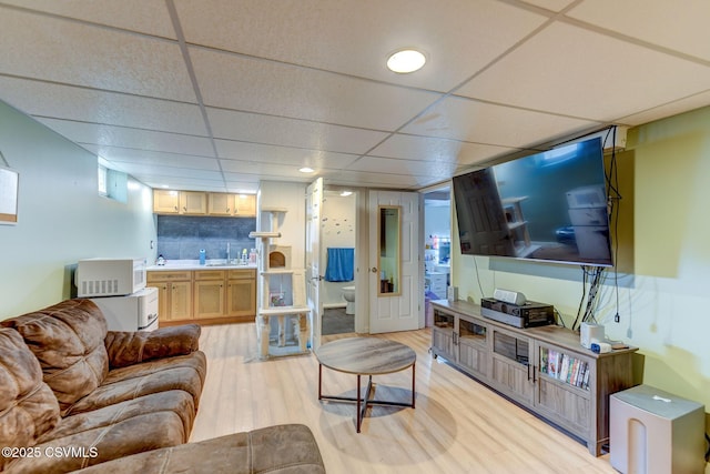 909 Fair St, Nescopeck, PA 18635 - living room with light wood-style flooring and a paneled ceiling