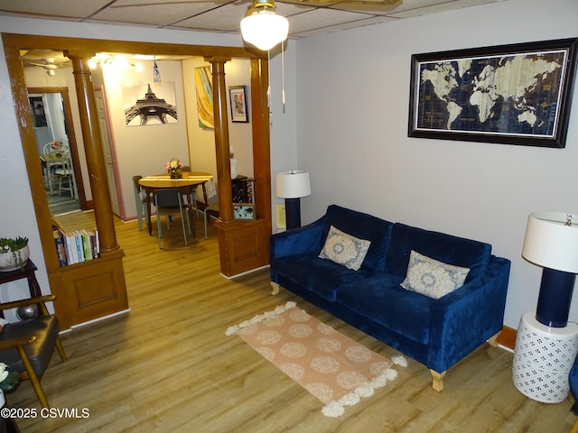 4 N Rock St, Shamokin, PA 17872 - living room with decorative columns, light wood-style floors, and a drop ceiling
