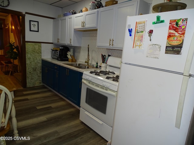4 N Rock St, Shamokin, PA 17872 - kitchen featuring white appliances, dark wood-style flooring, light countertops, backsplash, and blue cabinets