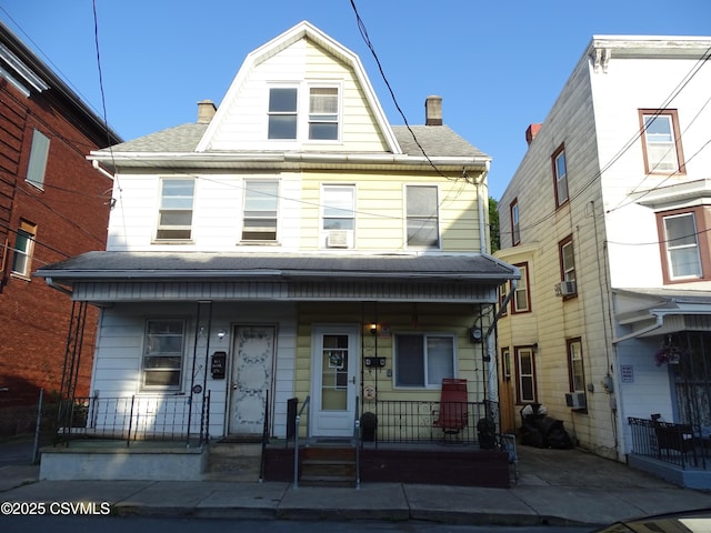 4 N Rock St, Shamokin, PA 17872 - view of property with a porch, a chimney, and roof with shingles