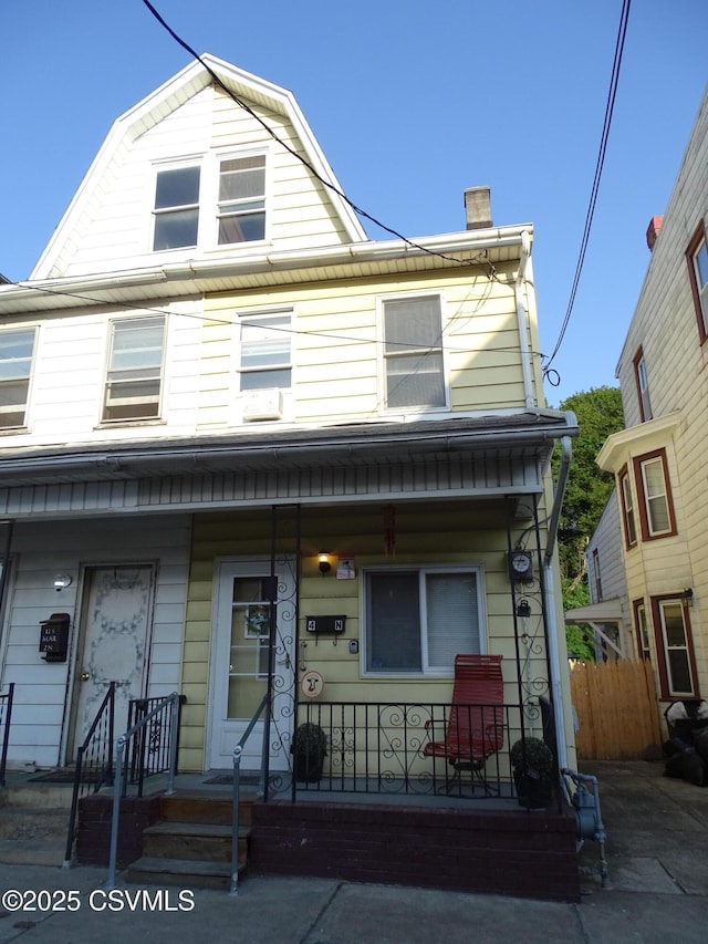4 N Rock St, Shamokin, PA 17872 - view of front of home featuring a gambrel roof, covered porch, and a chimney