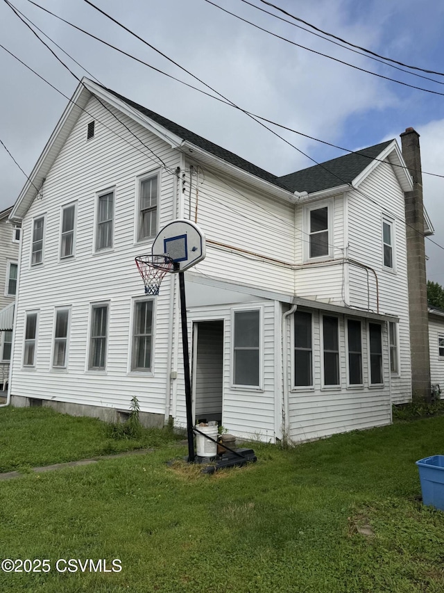 615 Broad St, Berwick, PA 18603 - rear view of property featuring a chimney and a yard