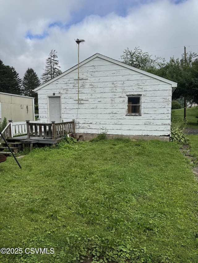 615 Broad St, Berwick, PA 18603 - rear view of house featuring a wooden deck and a lawn