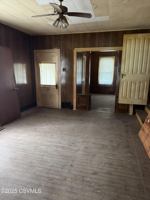 615 Broad St, Berwick, PA 18603 - entrance foyer featuring wooden walls, ceiling fan, and hardwood / wood-style flooring