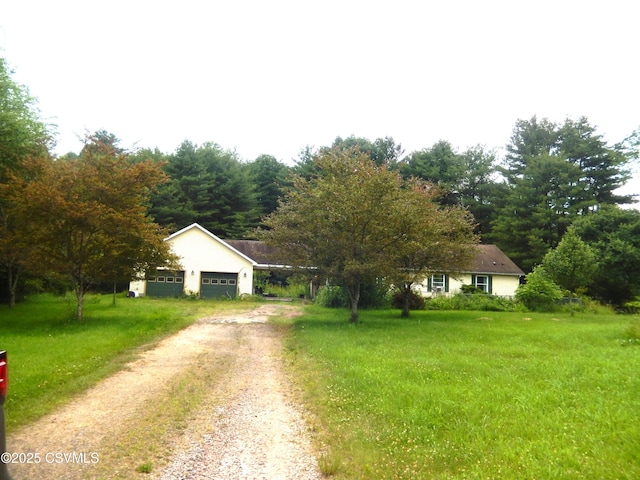32 Schoolhouse Rd, Benton, PA 17814 - single story home featuring dirt driveway and a garage