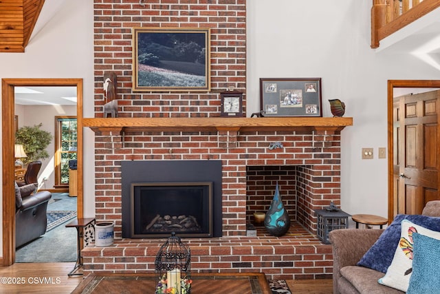 68 March Cir, Winfield, PA 17889 - living area featuring a brick fireplace and wood finished floors