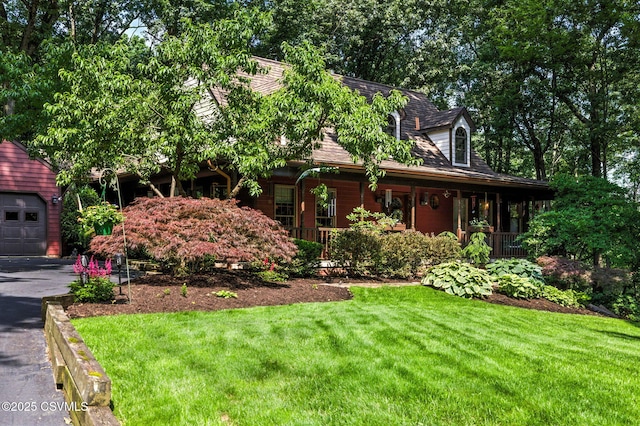 68 March Cir, Winfield, PA 17889 - view of front of home with a front lawn, a porch, and a garage