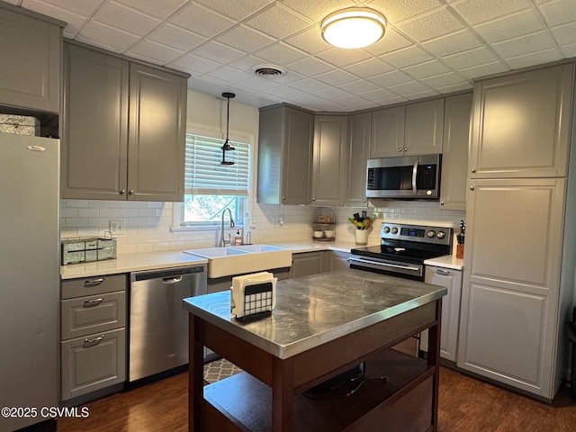 150 Blue Spruce Ln, Shamokin, PA 17872 - kitchen with appliances with stainless steel finishes, gray cabinets, dark wood-style flooring, and tasteful backsplash