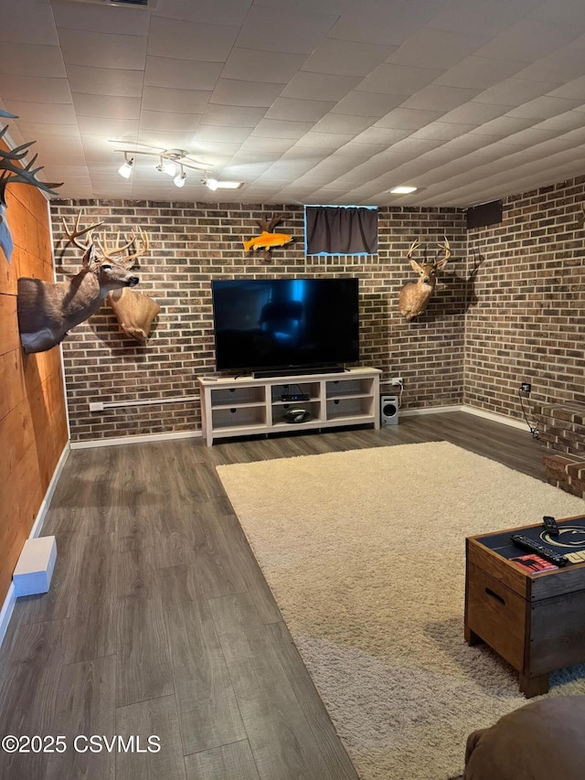 150 Blue Spruce Ln, Shamokin, PA 17872 - living area featuring brick wall and wood finished floors