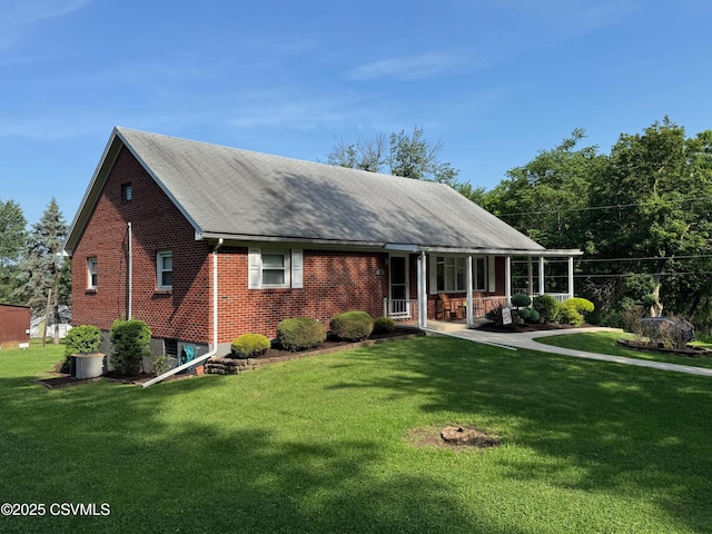 150 Blue Spruce Ln, Shamokin, PA 17872 - view of front facade with a front yard, brick siding, and a porch