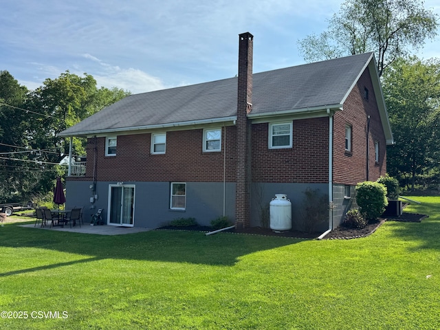 150 Blue Spruce Ln, Shamokin, PA 17872 - back of property with a chimney, a lawn, a patio area, and brick siding