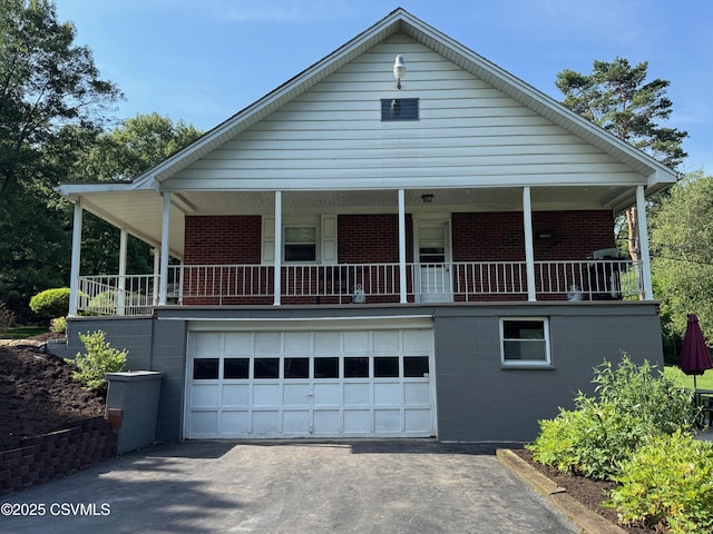 150 Blue Spruce Ln, Shamokin, PA 17872 - view of front of property with asphalt driveway, a garage, and brick siding