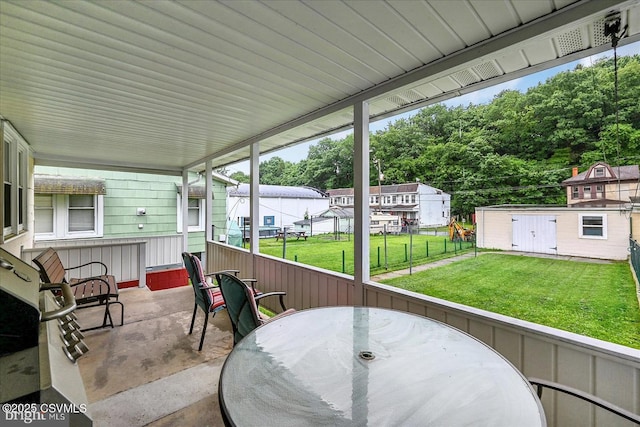 1114 W Arch St, Coal Township, PA 17866 - view of patio / terrace featuring outdoor dining area, an outdoor structure, and view of wooded area