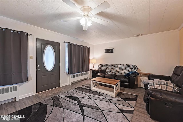 1114 W Arch St, Coal Township, PA 17866 - living room featuring radiator, ornamental molding, wood finished floors, and ceiling fan