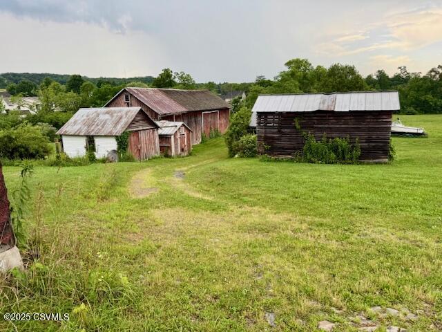 352 Turkey Hill Rd, Elysburg, PA 17824 - view of green lawn featuring an outbuilding