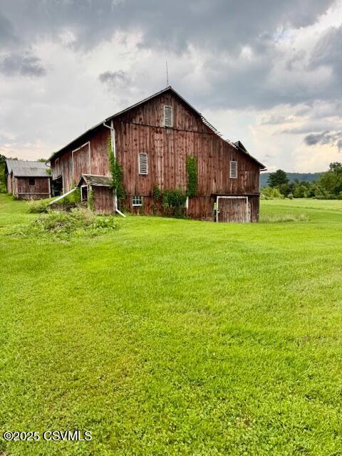 352 Turkey Hill Rd, Elysburg, PA 17824 - view of home's exterior featuring a barn, a yard, and an outdoor structure