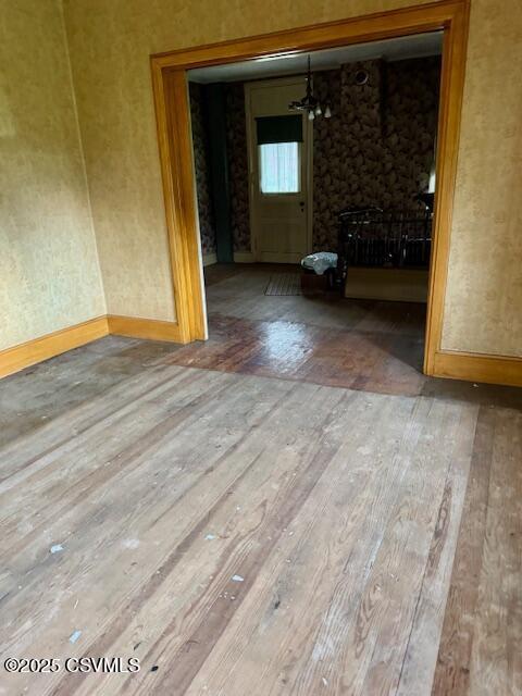 352 Turkey Hill Rd, Elysburg, PA 17824 - empty room with wood-type flooring and a chandelier