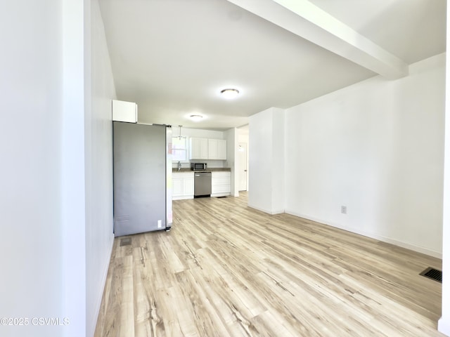 1613 2nd Ave, Berwick, PA 18603 - unfurnished living room featuring light wood-style floors and a sink