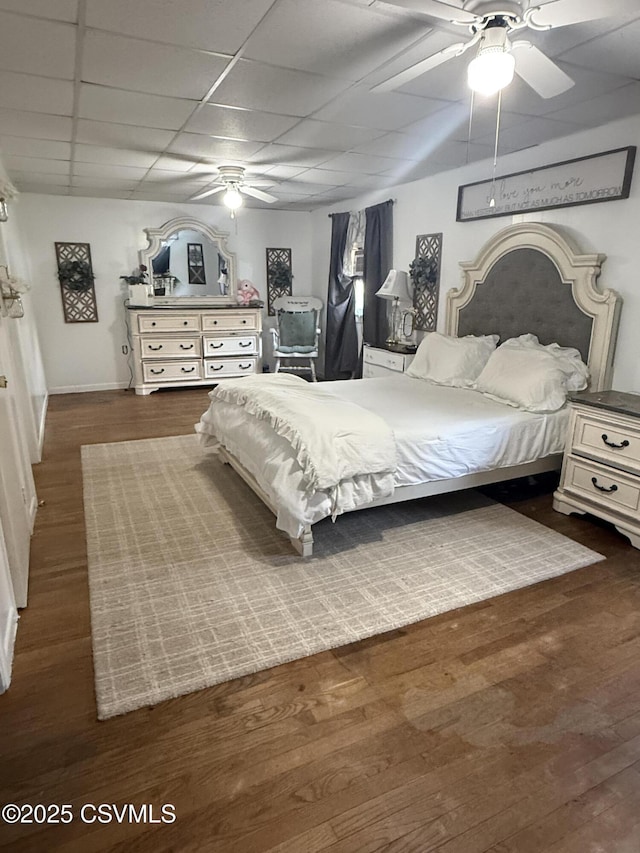 223 N Vine St, Shamokin, PA 17872 - bedroom with wood finished floors, a paneled ceiling, and a ceiling fan