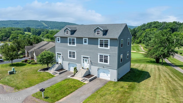5 Williamsburg Blvd, Bloomsburg, PA 17815 - view of front facade featuring an attached garage, driveway, and a front yard