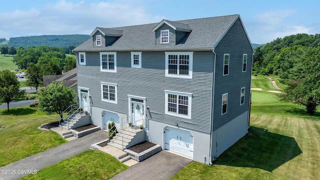 5 Williamsburg Blvd, Bloomsburg, PA 17815 - view of front facade featuring a garage, asphalt driveway, and a front yard
