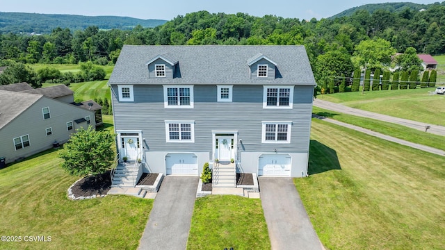 5 Williamsburg Blvd, Bloomsburg, PA 17815 - view of front of home featuring a garage, asphalt driveway, and a front lawn