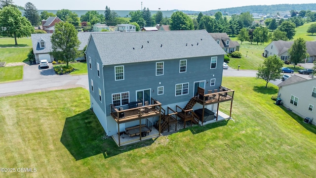 5 Williamsburg Blvd, Bloomsburg, PA 17815 - rear view of property with a deck, a shingled roof, and a yard
