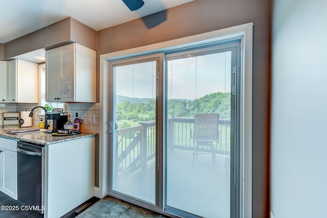 5 Williamsburg Blvd, Bloomsburg, PA 17815 - kitchen with white cabinets, plenty of natural light, tasteful backsplash, and a ceiling fan