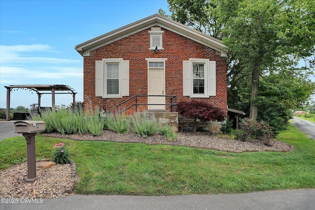 12 State School Rd, Selinsgrove, PA 17870 - view of front facade with brick siding, a front yard, and a pergola