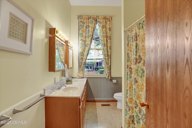 12 State School Rd, Selinsgrove, PA 17870 - bathroom featuring double vanity, tile patterned floors, and a wainscoted wall