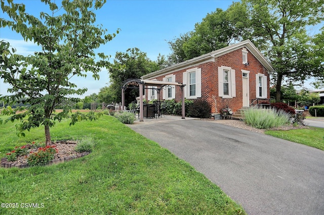 12 State School Rd, Selinsgrove, PA 17870 - view of front of house featuring brick siding, a front lawn, and asphalt driveway