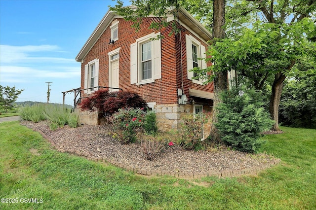 12 State School Rd, Selinsgrove, PA 17870 - view of home's exterior featuring brick siding and a lawn