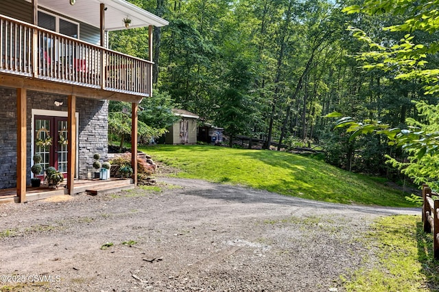 178 Schooners Run, Shickshinny, PA 18655 - view of grassy yard featuring a shed, french doors, and a deck