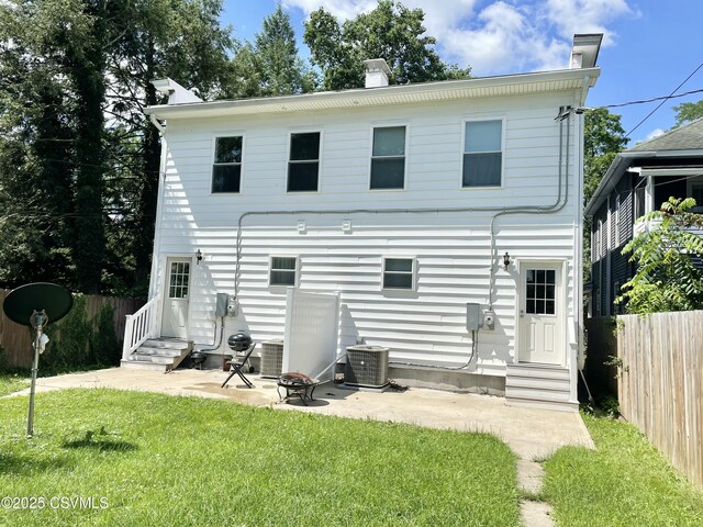 130-132 S 5th St, Lewisburg, PA 17837 - rear view of house featuring entry steps, a chimney, and a patio