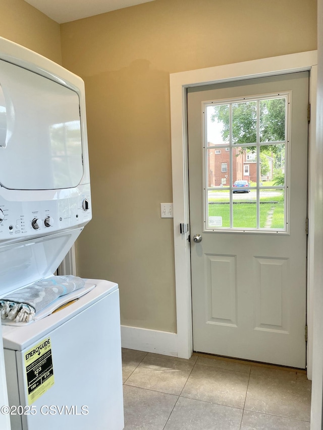 130-132 S 5th St, Lewisburg, PA 17837 - laundry area with stacked washer and clothes dryer and light tile patterned flooring