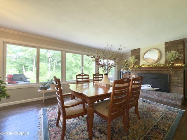 101 Twig Ln, Sunbury, PA 17801 - dining area featuring wood finished floors, a fireplace, and ornamental molding
